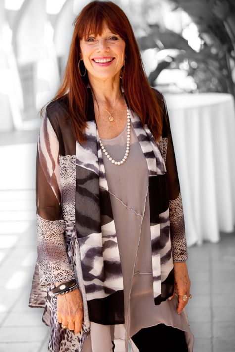 Sisterhood Planet Community | Janet Atwood smiling in Gray Clothing